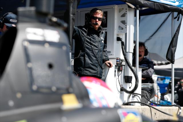 Carlin Strategist Davey Hamilton looks over Charlie Kimball's machine on pit lane prior to practice for the Honda Indy Grand Prix of Alabama -- Photo by: Joe Skibinski