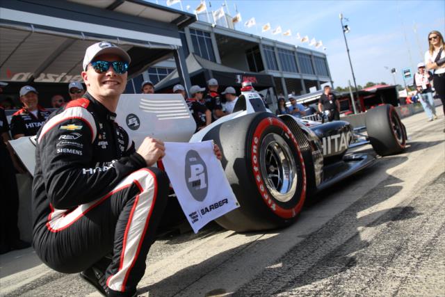 Josef Newgarden with the Verizon P1 Award flag on pit lane after winning the pole position for the Honda Indy Grand Prix of Alabama -- Photo by: Matt Fraver