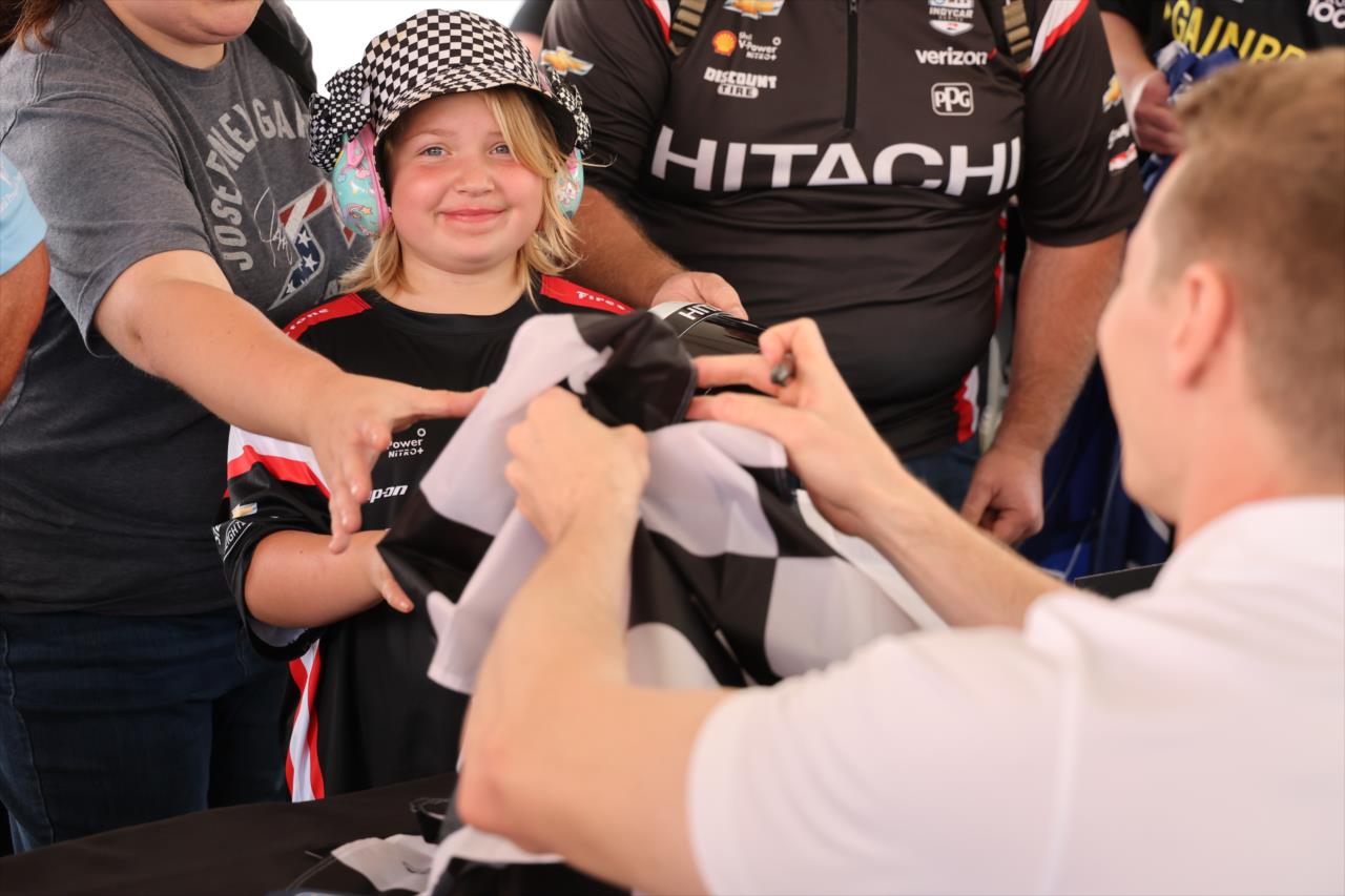 Josef Newgarden and Fan - Children's of Alabama Indy Grand Prix - By: Chris Owens -- Photo by: Chris Owens