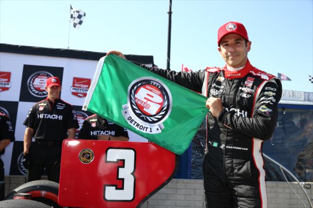 Helio Castroneves shows the Verizon P1 Award flag for winning the pole for Race 1 of the Chevrolet Indy Dual in Detroit -- Photo by: Chris Jones