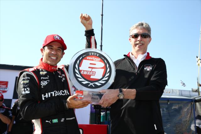 Helio Castroneves receives the Verizon P1 Award trophy for winning the pole for Race 1 of the Chevrolet Indy Dual in Detroit -- Photo by: Chris Jones