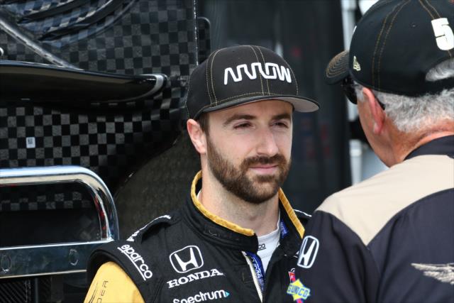 James Hinchcliffe chats with a team member along pit lane prior to practice for the Chevrolet Detroit Grand Prix -- Photo by: Bret Kelley
