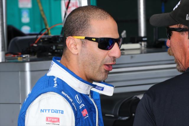 Tony Kanaan chats with INDYCAR Official Kevin 