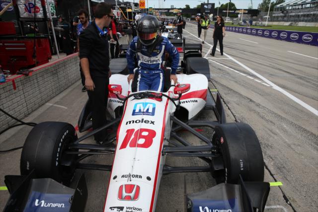 Esteban Gutierrez slides into his No. 18 Unifin Honda on pit lane prior to practice for the Chevrolet Detroit Grand Prix -- Photo by: Chris Jones