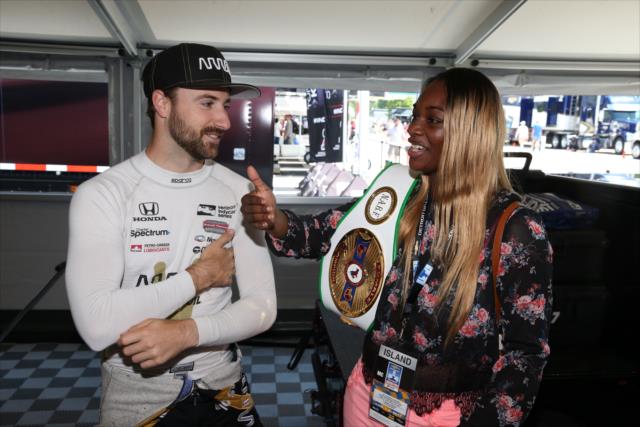 James Hinchcliffe and Olympic Gold Medalist Claressa Shields chat in the Schmidt Peterson Motorsports paddock -- Photo by: Chris Jones