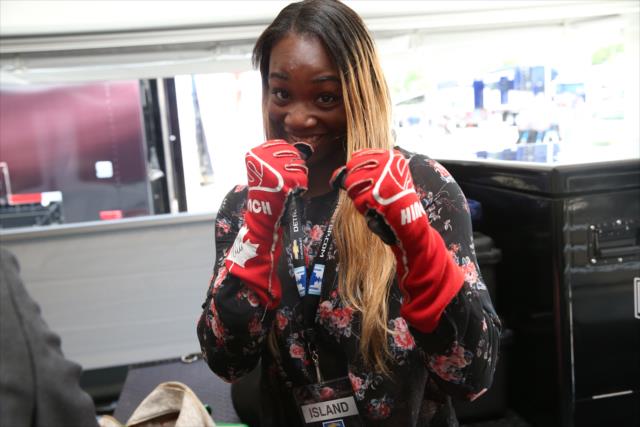 Olympic Gold Medalist Claressa Shields exchange gloves with James Hinchcliffe back in the Schmidt Peterson Motorsports paddock -- Photo by: Chris Jones