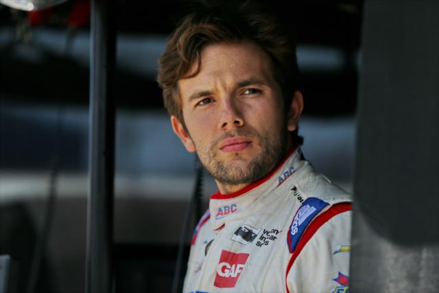Carlos Munoz looks down pit lane prior to practice for the Chevrolet Detroit Grand Prix -- Photo by: Chris Jones