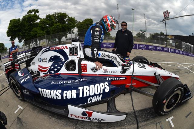 Graham Rahal slides into his No. 15 Turns For Troops Honda on pit lane prior to practice for the Chevrolet Detroit Grand Prix -- Photo by: Chris Owens