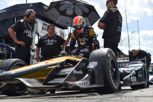 James Hinchcliffe slides into his No. 5 Arrow Honda on pit lane prior to practice for the Chevrolet Detroit Grand Prix -- Photo by: Chris Owens