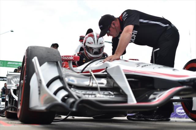Helio Castroneves slides into his No. 3 Hitachi Chevrolet on pit lane prior to practice for the Chevrolet Detroit Grand Prix -- Photo by: Chris Owens