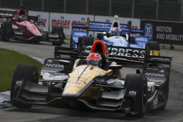 James Hinchcliffe leads a group through Turn 1 during Race 1 of the Chevrolet Detroit Grand Prix -- Photo by: Bret Kelley