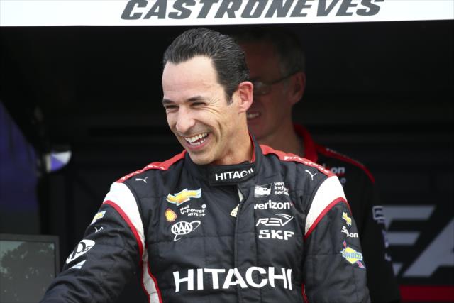 Helio Castroneves with a light moment on pit lane during pre-race festivities for Race 1 of the Chevrolet Detroit Grand Prix -- Photo by: Bret Kelley