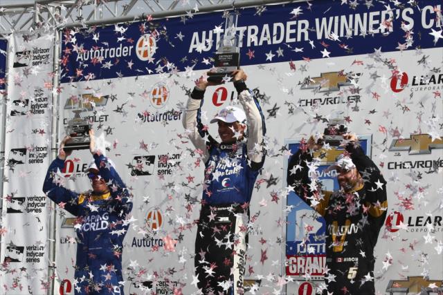 The confetti flies as Graham Rahal, Scott Dixon, and James Hinchcliffe hoist their trophies in Victory Circle following Race 1 of the Chevrolet Detroit Grand Prix -- Photo by: Bret Kelley