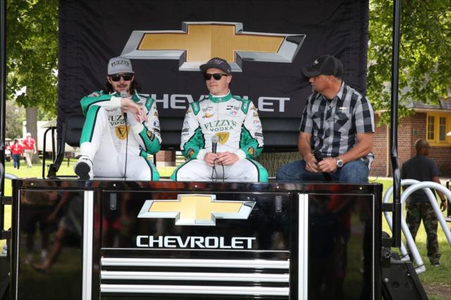JR Hildebrand and Spencer Pigot chat with fans from the Chevrolet stage in the Detroit Belle Isle Fan Village -- Photo by: Chris Jones