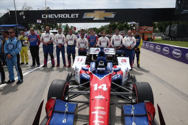 Carlos Munoz and the A.J. Foyt Racing team stand at attention for the National Anthems during pre-race festivities for Race 1 of the Chevrolet Detroit Grand Prix -- Photo by: Chris Jones