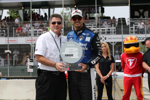 Graham Rahal accepts the Verizon P1 Award for claiming the pole position for Race 1 of the Chevrolet Detroit Grand Prix -- Photo by: Chris Jones