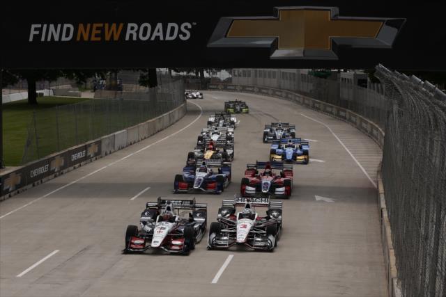 Graham Rahal and Helio Castroneves bring the field to the green flag to start Race 1 of the Chevrolet Detroit Grand Prix -- Photo by: Chris Jones