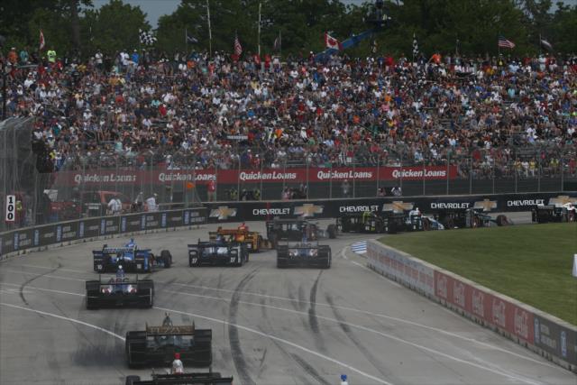 The field streams into Turn 1 during the start of Race 1 of the Chevrolet Detroit Grand Prix -- Photo by: Chris Jones