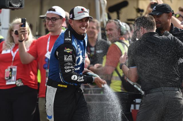 Graham Rahal sprays the champagne in Victory Circle after winning Race 1 of the Chevrolet Detroit Grand Prix -- Photo by: Chris Owens