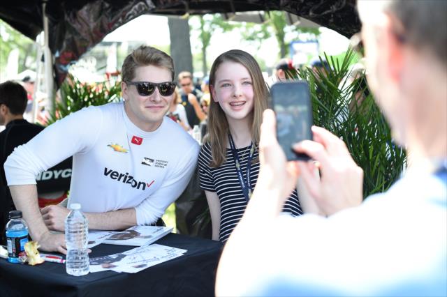 Josef Newgarden poses for a photo during the autograph session in the INDYCAR Fan Village at Belle Isle Park in Detroit -- Photo by: Chris Owens