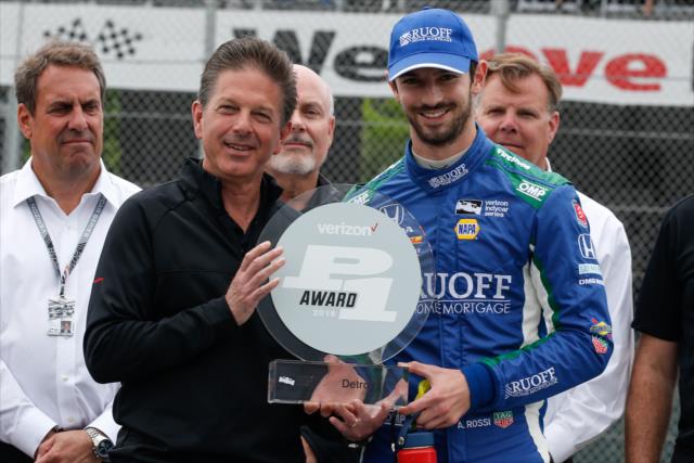Alexander Rossi accepts the Verizon P1 Award for winning the pole position during pre-race festivities for Race 2 of the Chevrolet Detroit Grand Prix at Belle Isle Park -- Photo by: Joe Skibinski