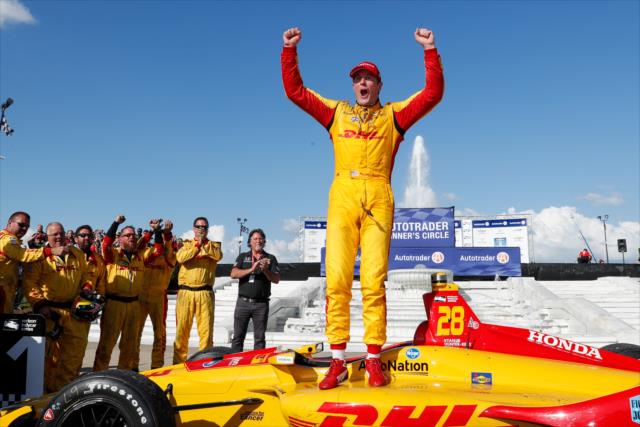 Ryan Hunter-Reay begins the celebration in Victory Circle after winning Race 2 of the Chevrolet Detroit Grand Prix at Belle Isle Park -- Photo by: Joe Skibinski