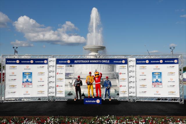 The podium of Ryan Hunter-Reay, Will Power, and Ed Jones with their trophies in Victory Circle following Race 2 of the Chevrolet Detroit Grand Prix at Belle Isle Park -- Photo by: Joe Skibinski