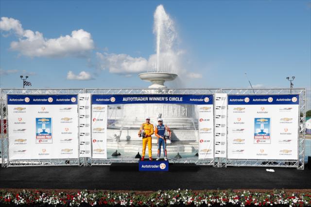 Scott Dixon and Ryan Hunter-Reay in Victory Circle as the winners of the dual races of the Chevrolet Detroit Grand Prix at Belle Isle Park -- Photo by: Joe Skibinski