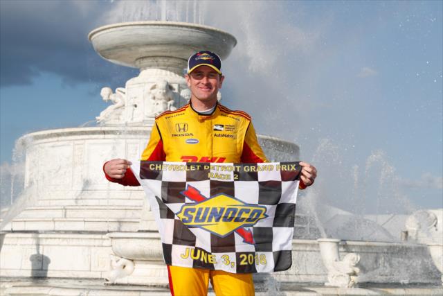 Ryan Hunter-Reay with the Sunoco Checkered Flag in Victory Circle after winning Race 2 of the Chevrolet Detroit Grand Prix at Belle Isle Park -- Photo by: Joe Skibinski