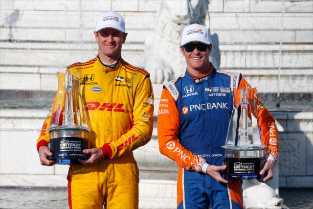 Ryan Hunter-Reay and Scott Dixon with their trophies in Victory Circle as the dual race winners of the Chevrolet Detroit Grand Prix at Belle Isle Prk -- Photo by: Joe Skibinski