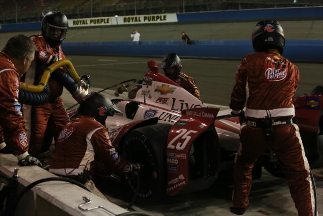 The crew of Marco Andretti go to work during an early pit stop -- Photo by: Chris Jones
