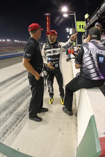 Tony Kanaan chats with his team following the finaly practice at Auto Club Speedway -- Photo by: Richard Dowdy