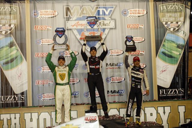 Will Power, Ed Carpenter, and Tony Kanaan raise their trophies as the podium winners of the MAVTV 500 at Auto Club Speedway -- Photo by: Richard Dowdy