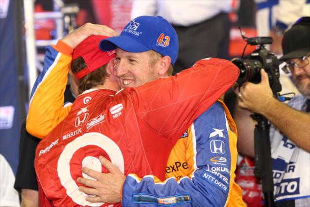 Charlie Kimball gives teammate Scott Dixon a celebratory hug following the MAVTV 500 -- Photo by: Chris Jones