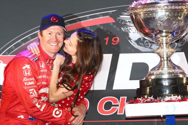 Scott Dixon is congratulated by his wife, Emma, after winning the 2013 IZOD IndyCar Series Championship -- Photo by: Chris Jones