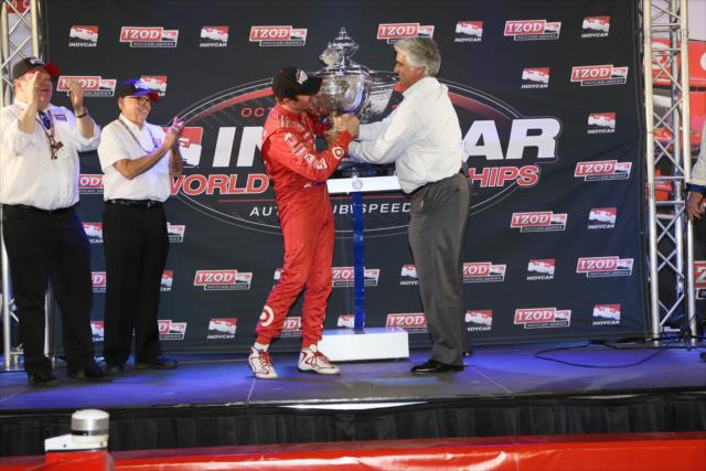 2013 IZOD IndyCar Series champion Scott Dixon receives the Astor Cup from INDYCAR CEO Mark Miles -- Photo by: Chris Jones