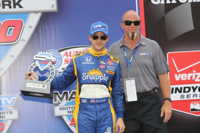 Marco Andretti accepts his 3rd Place trophy for the 2015 MAVTV 500 at Auto Club Speedway -- Photo by: Chris Jones