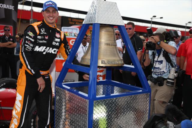 Graham Rahal rings the Victory Bell following his win in the MAVTV 500 at Auto Club Speedway -- Photo by: Chris Jones