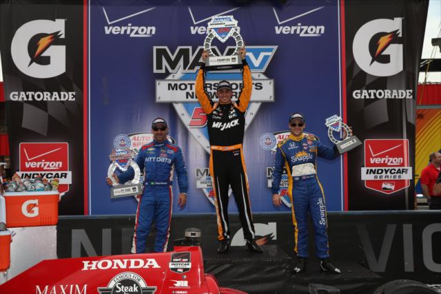 The podium of Graham Rahal, Tony Kanaan, and Marco Andretti with their trophies in Victory Lane following the MAVTV 500 at Auto Club Speedway -- Photo by: Chris Jones