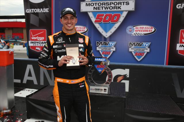 Graham Rahal with his Tag Heuer watch in Victory Lane following his win in the MAVTV 500 at Auto Club Speedway -- Photo by: Chris Jones