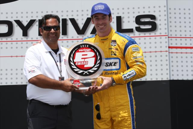 Simon Pagenaud accepts the Verizon P1 Award for his pole position during pre-race festivities for the MAVTV 500 at Auto Club Speedway -- Photo by: Chris Jones