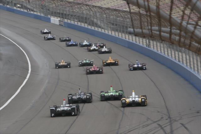 The field charges into Turn 1 during the start of the MAVTV 500 at Auto Club Speedway -- Photo by: Chris Jones