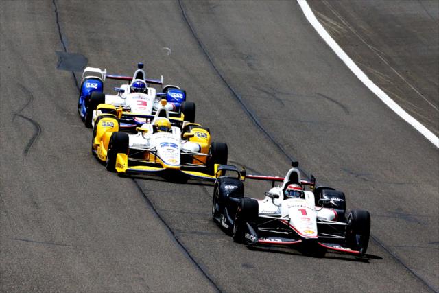 Will Power leads teammates Simon Pagenaud and Helio Castroneves down the frontstretch during the MAVTV 500 at Auto Club Speedway -- Photo by: Chris Jones