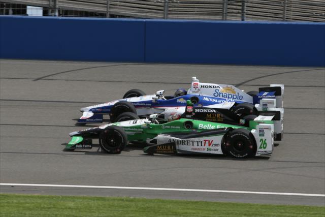 Marco Andretti and Carlos Munoz go side-by-side during the MAVTV 500 at Auto Club Speedway -- Photo by: Chris Jones