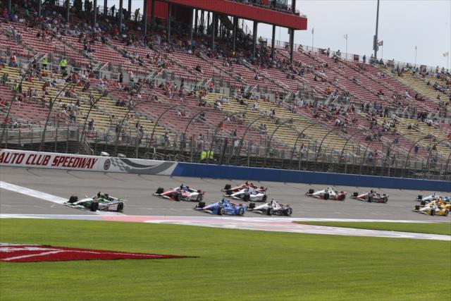 Carlos Munoz leads the field to the green flag for a restart of the MAVTV 500 at Auto Club Speedway -- Photo by: Chris Jones