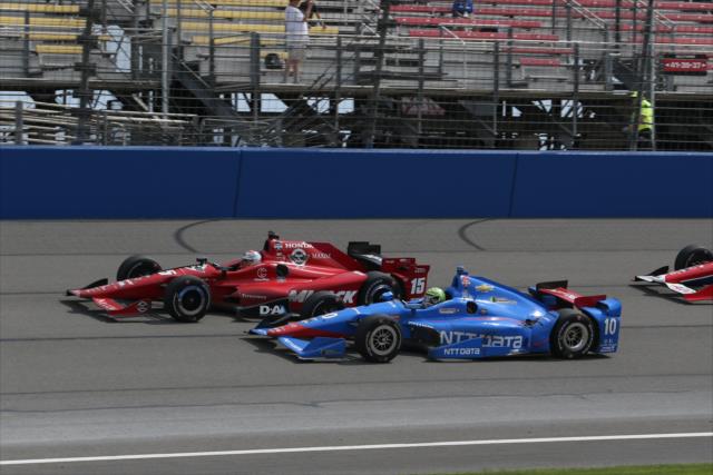 Graham Rahal and Tony Kanaan go wheel-to-wheel during the late stages of the MAVTV 500 at Auto Club Speedway -- Photo by: Chris Jones