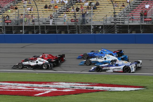 The field dice it up along the frontstretch during the MAVTV 500 at Auto Club Speedway -- Photo by: Chris Jones