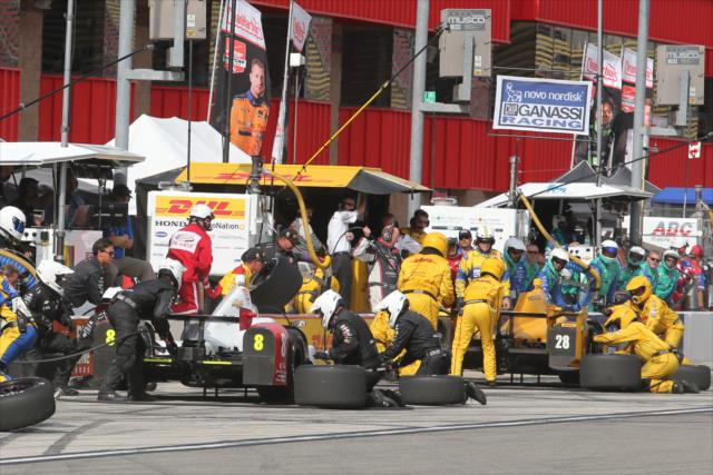 Pit lane comes to life with early stops during the MAVTV 500 at Auto Club Speedway -- Photo by: Chris Jones