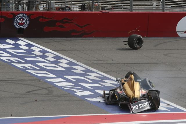 Ryan Briscoe slides across the start/finish line after being collected in a late incident at the conclusion of the MAVTV 500 at Auto Club Speedway -- Photo by: Chris Jones
