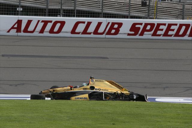 Ryan Briscoe sits in his Honda after his incident at the conclusion of the MAVTV 500 at Auto Club Speedway -- Photo by: Chris Jones